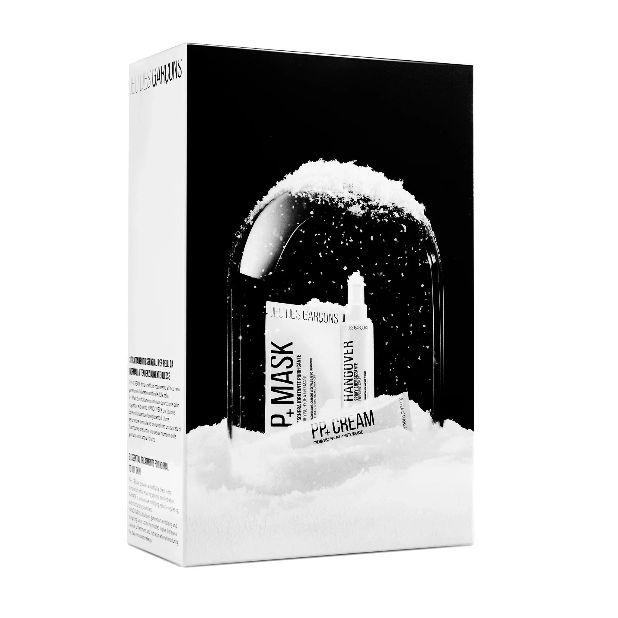 Confezione regalo skincare con maschera, crema e siero sotto una campana di vetro innevata