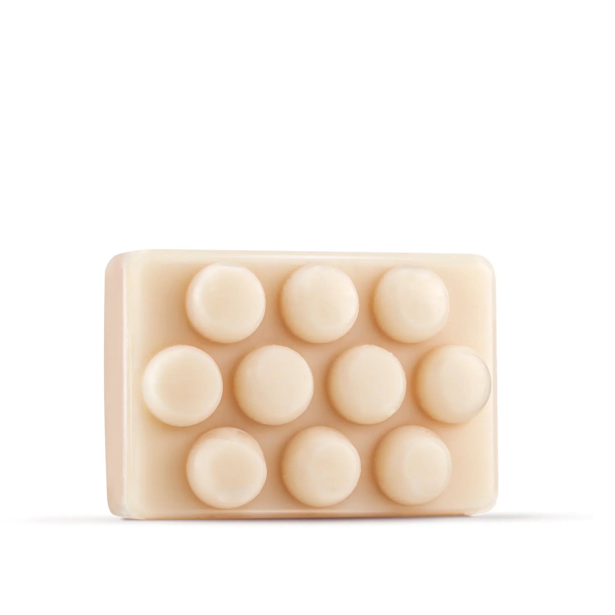 Sapone vegetale solido beige con forma rettangolare e rilievi a bottoni tondi per SPA